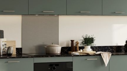 Kitchen with stainless steel splashback behind the hob