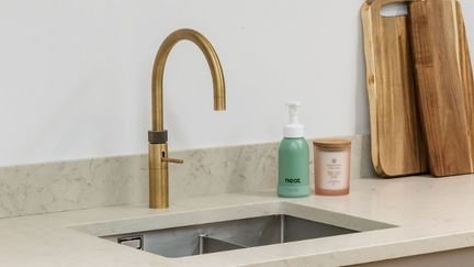 Kitchen with brass tap