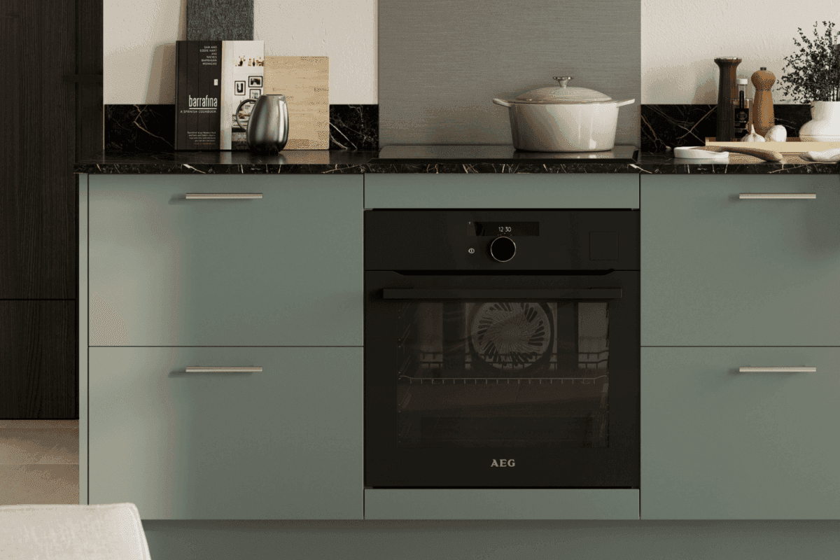 Kitchen with Franklin Reed Green doors and silver handles