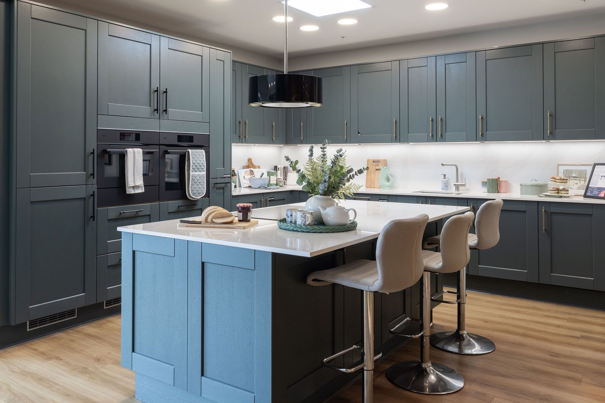 Showroom kitchen with Maine Heritage Green shaker doors