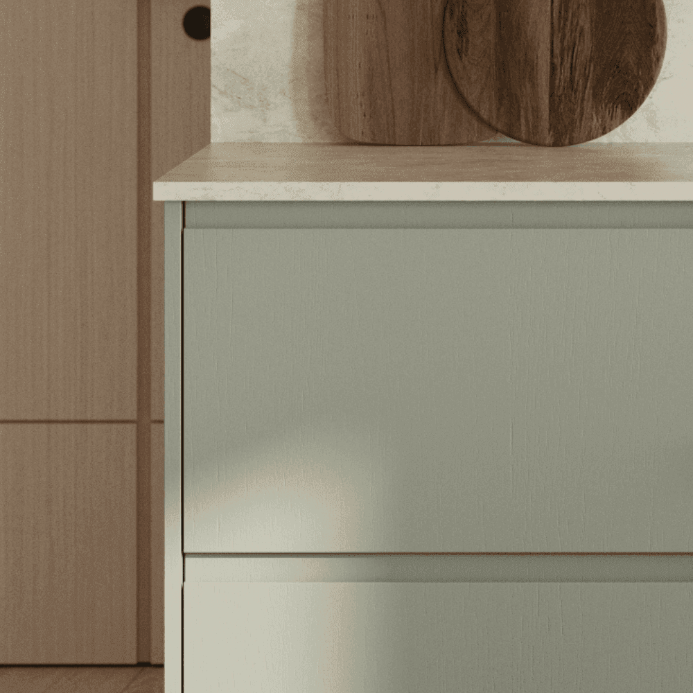 Close up of J Pull door in sage green with white worktop