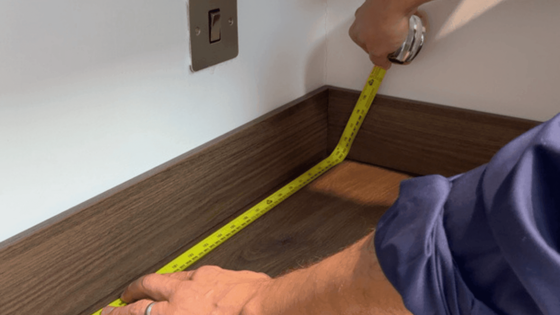 Person measuring their kitchen