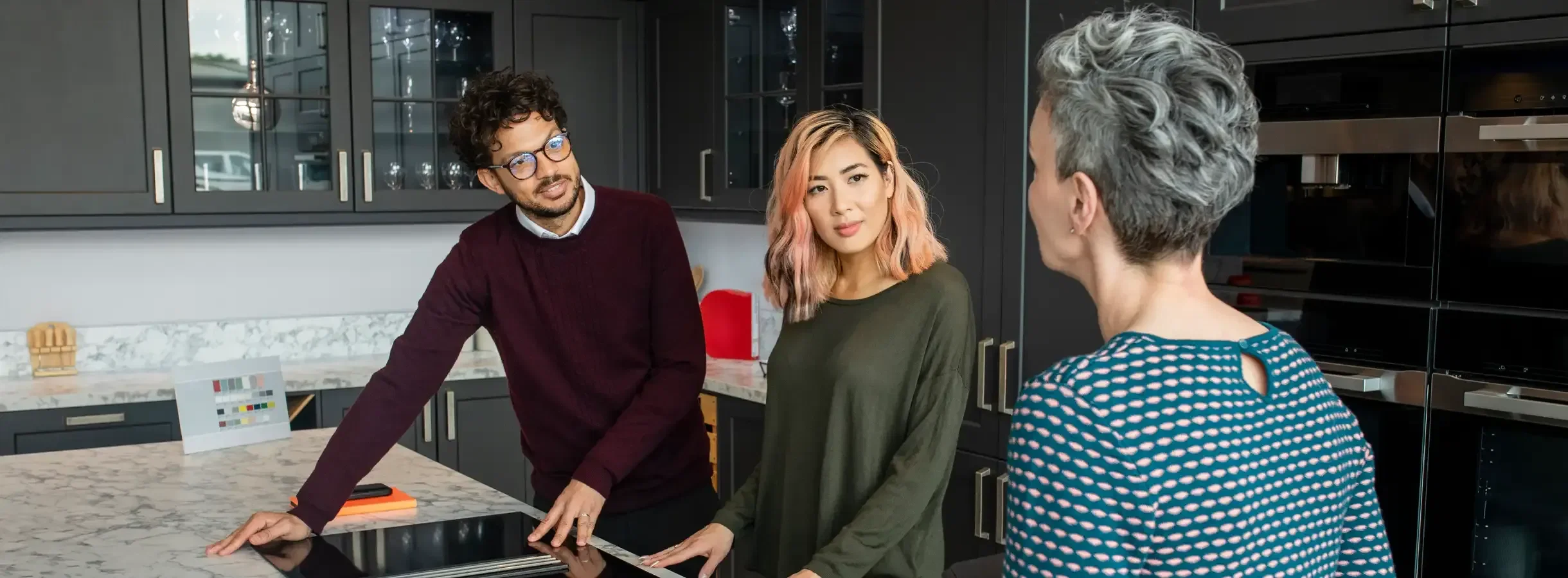 People in kitchen showroom