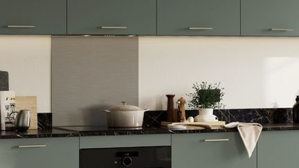 Kitchen with stainless steel splashback behind the hob
