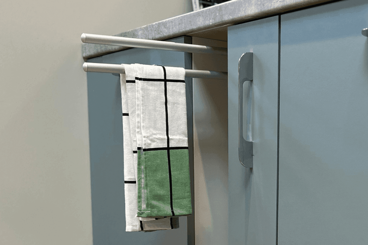 Kitchen with a tray space and towel rail