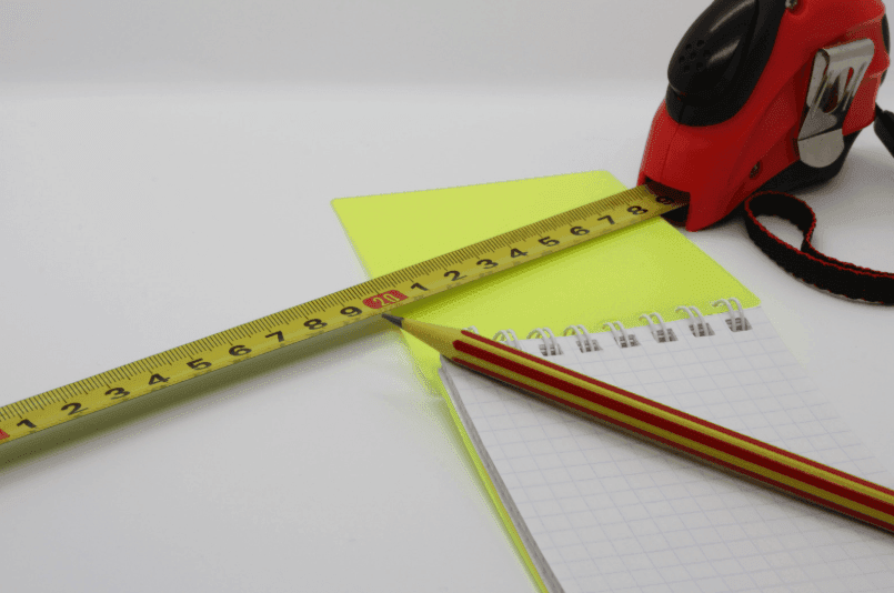Tape measure, pencil and notepad