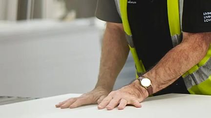 Person working with material in factory