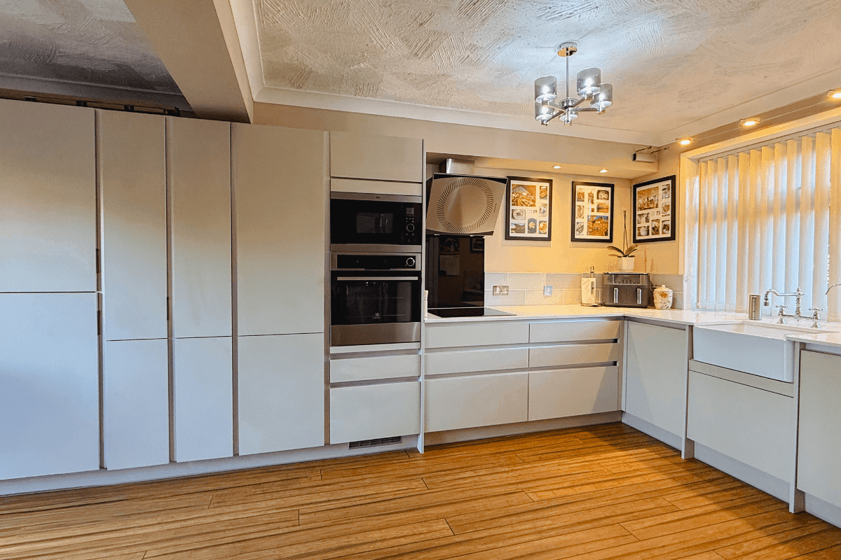 Handleless matt cashmere kitchen with belfast sink