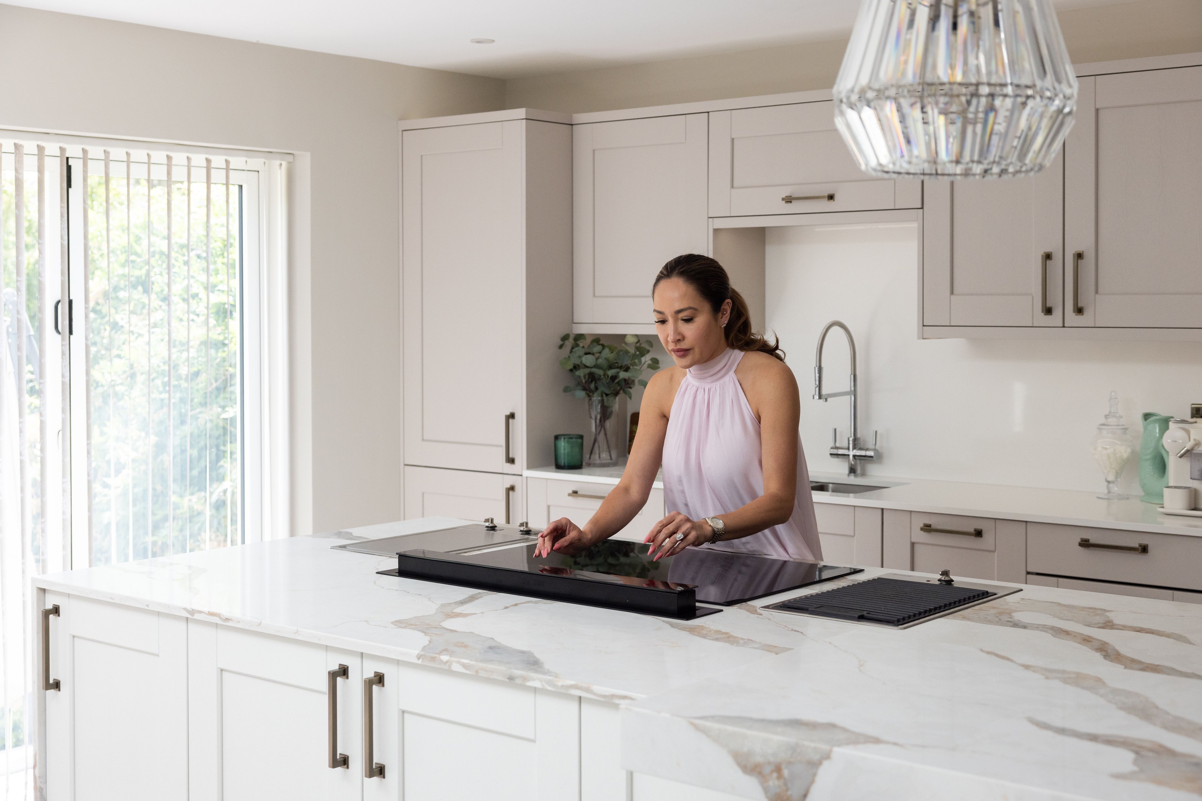Customer in their PRK kitchen using pop up extractor