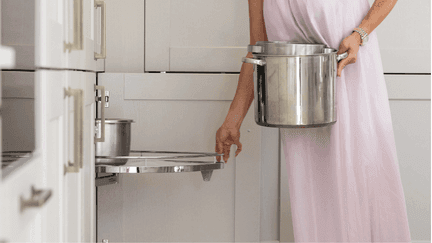 Customers in their PRK kitchen using the swing out corner shelving