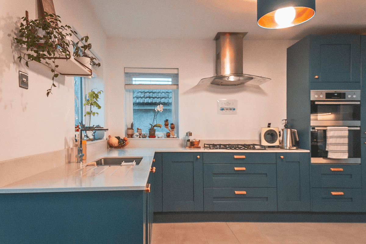 Shaker kitchen with blue doors and copper cup and knob handles
