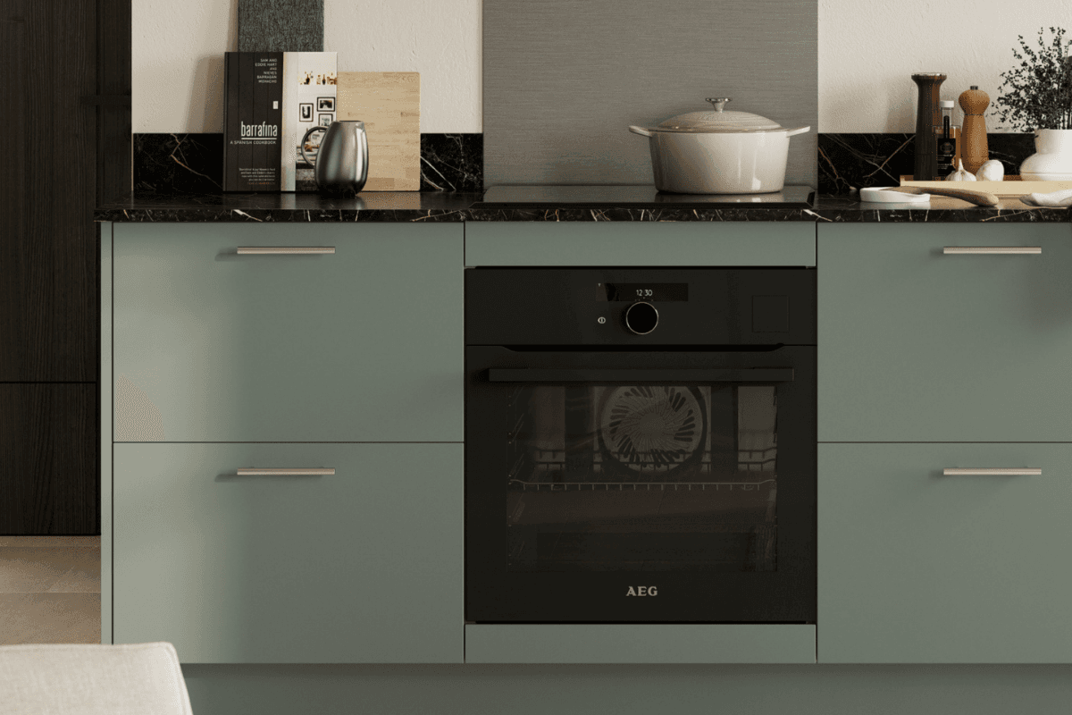 Kitchen with Franklin Reed Green doors and silver handles