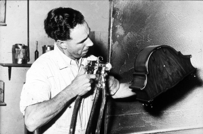 Person hand making a medium sized clock decades ago
