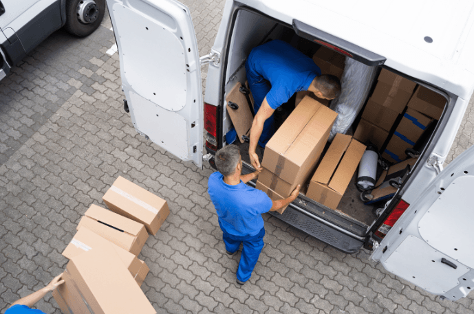 People carrying boxes making a delivery